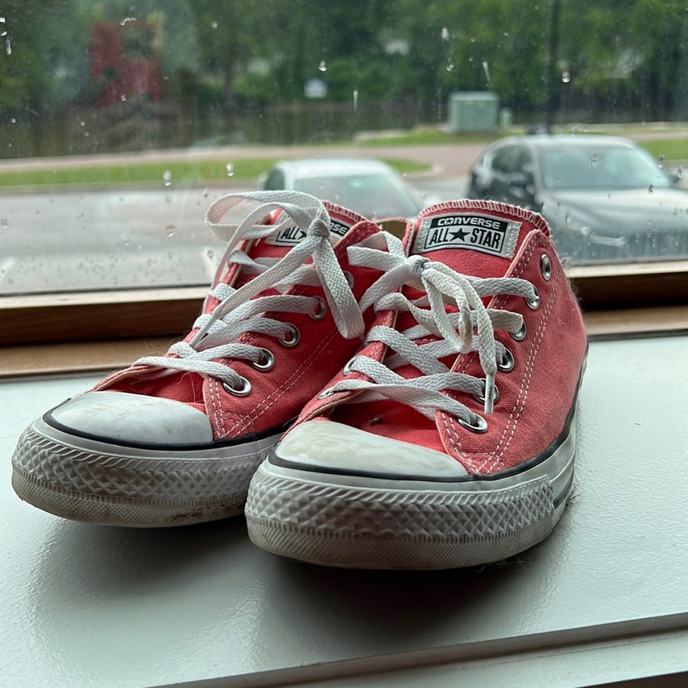 Converse pink sneakers.